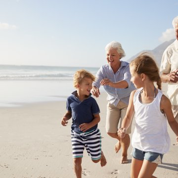 happy seniors running with nephews on the beach medical alert systems lifestation benefits